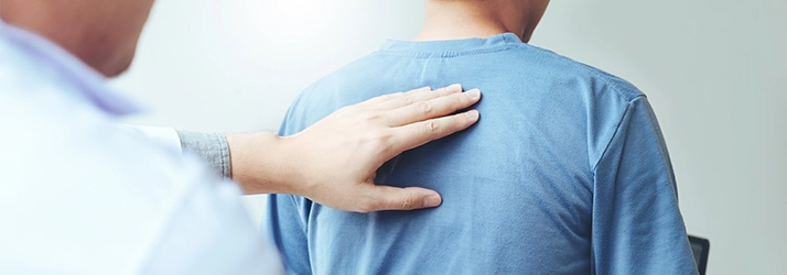 A chiropractor giving a back exam.