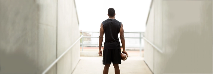 Chiropractic Fremont CA Football Player A man standing with a football.