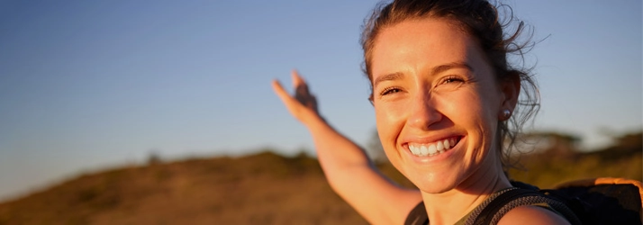 Chiropractic Fremont CA Happy Woman A happy woman smiling outside.