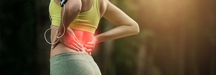 Chiropractic Fremont CA Low Back Pain A woman holding her lower back.