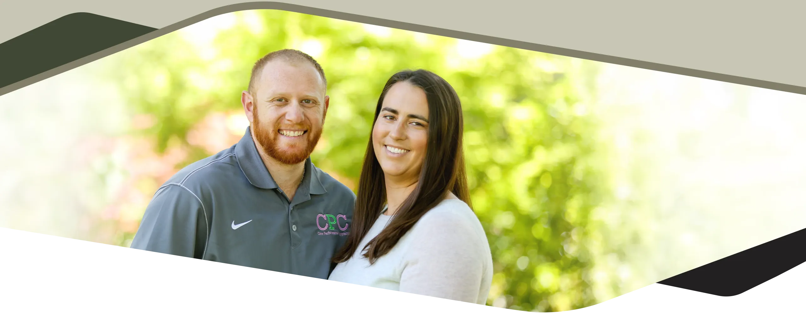 Chiropractor Fremont CA Alex Lee With His Wife Outside Dark Chiropractor Alex Lee smiling with his wife.